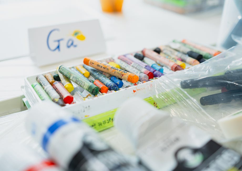 Brightly colored pastels and art supplies in a creative Japanese art studio setting.