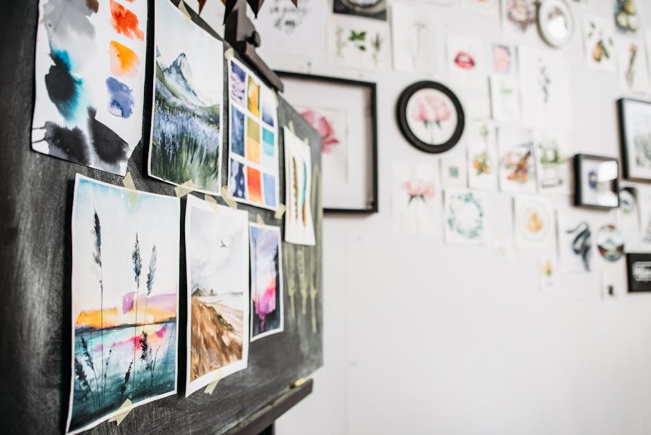 Art studio interior showcasing watercolor paintings on a board, displaying creativity and design.